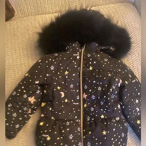 Moschino Puffer with fur hood collar.